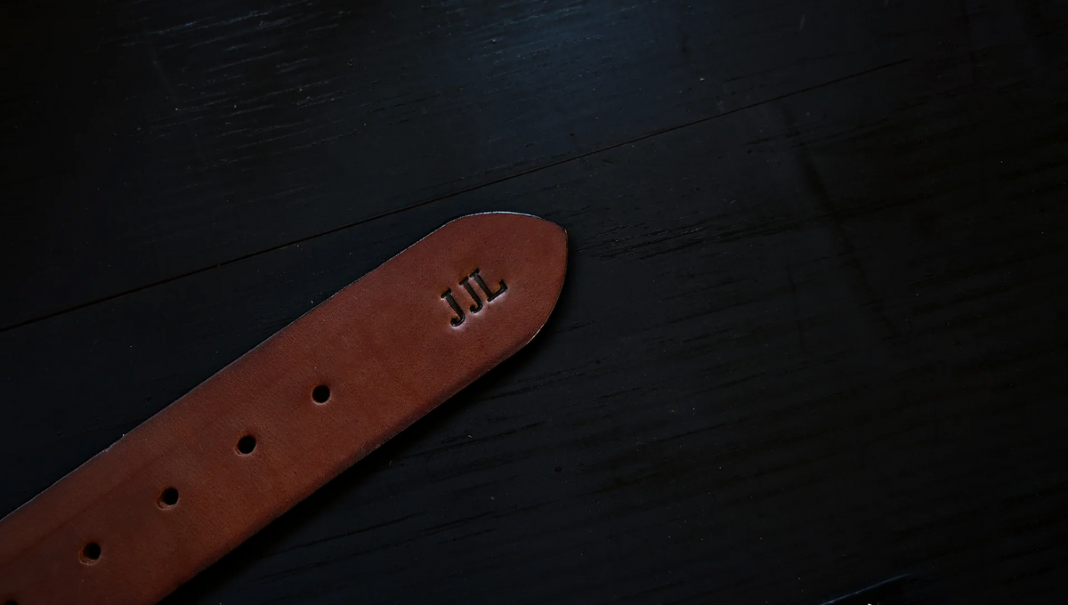 brigadier belt personalized with embossed initials, shown as J J L.