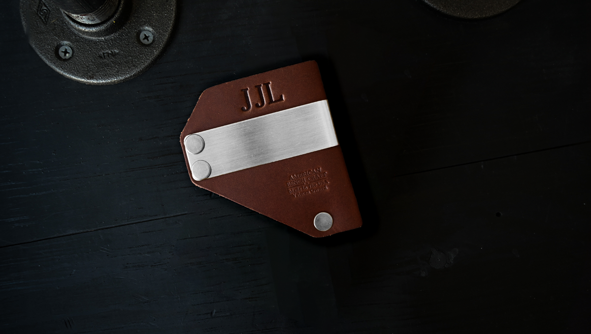 Caliber Clip Monogram personalized with embossed initials, shown as J J L.