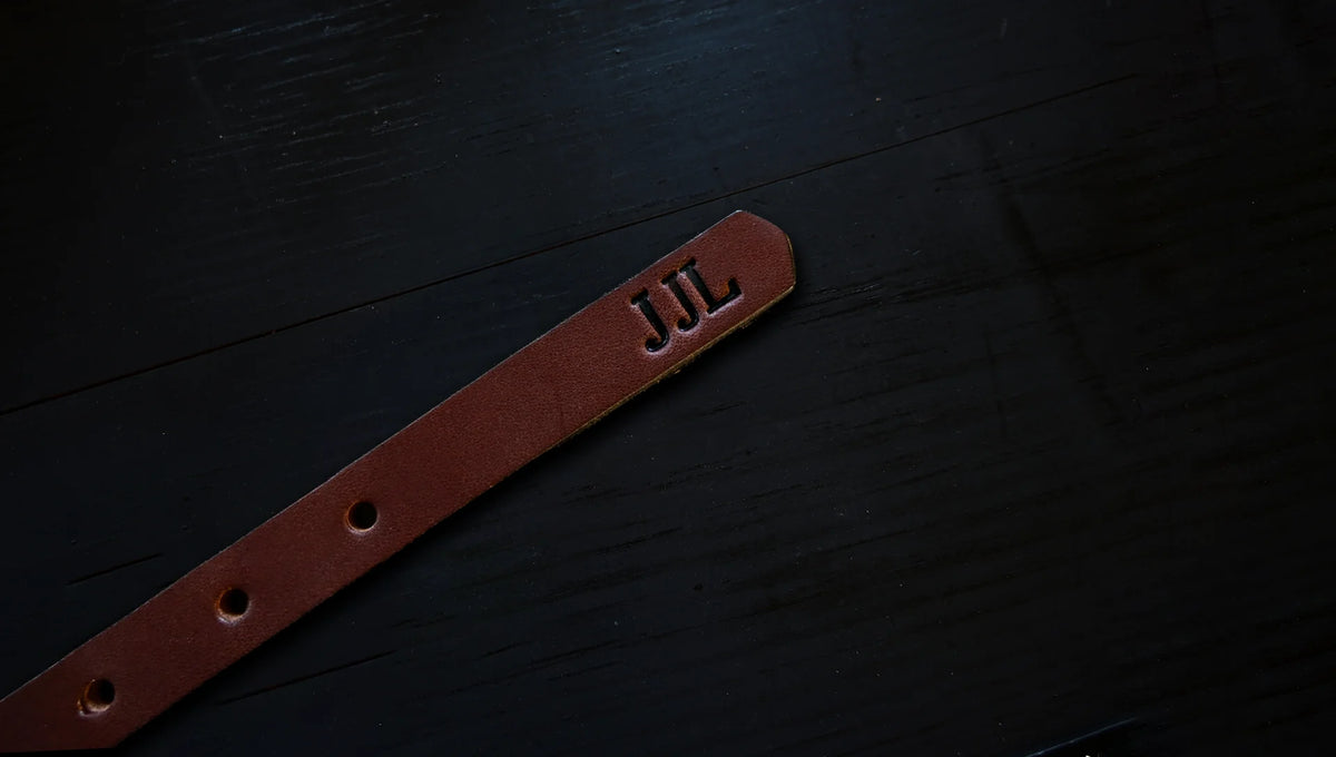 cheyenne belt personalized with embossed initials, shown as J J L.