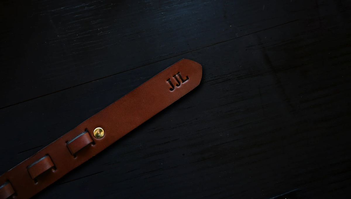 equestrian belt personalized with embossed initials, shown as J J L.