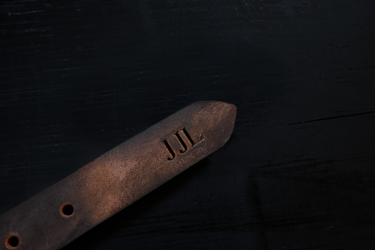 1.25" Water Buffalo Monogramming personalized with embossed initials, shown as J J L.